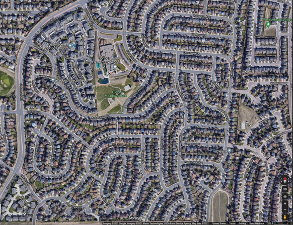 Google Satellite map image of a neighborhood showing a multitude of houses.  A typical area we mail our Postcard Co-Op Mailers.