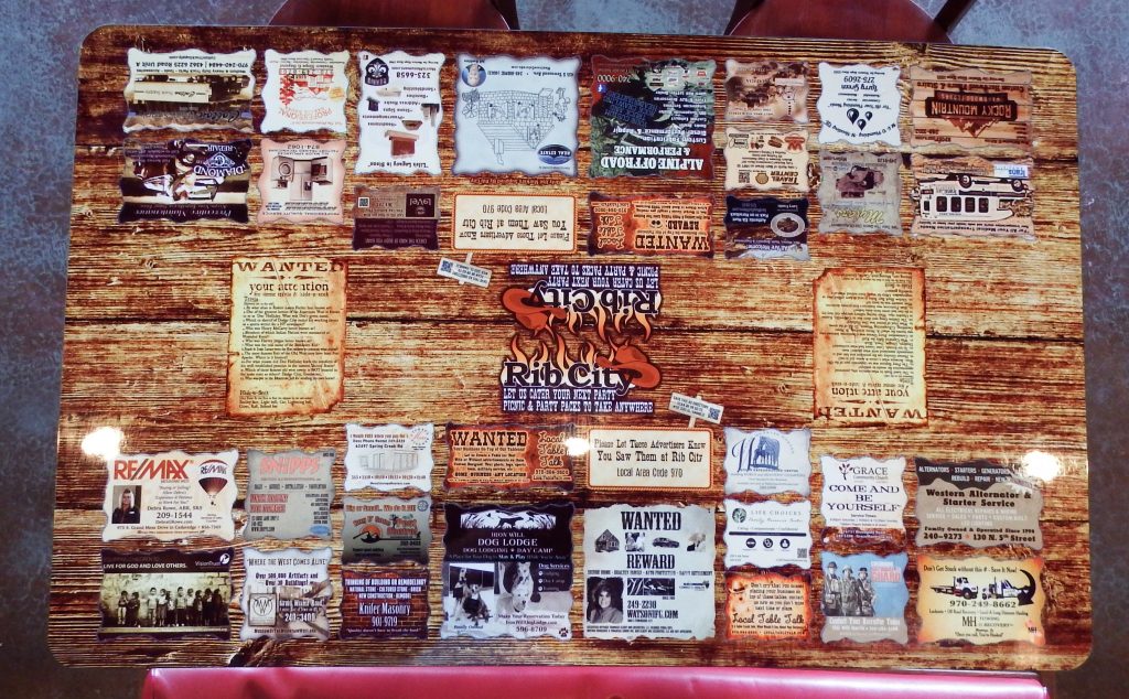 Tabletop ads on a restaurant table at Rib City in Montrose, Colorado